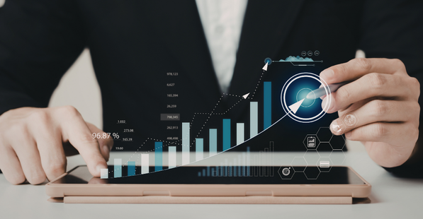 Image of a person analyzing data on a tablet
