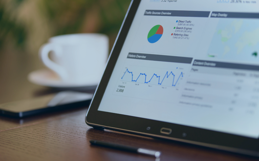 a device with analytics on the screen to represent PMMCs CDM Pricing Software