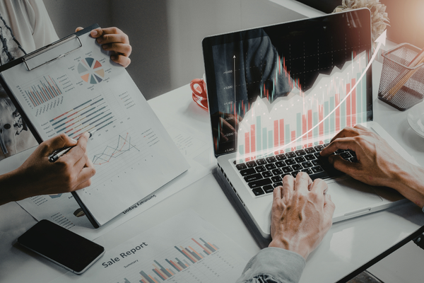 Two people solving problems using data and modeling tools