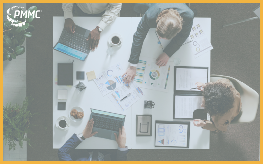 Overhead view of colleagues collaborating at a conference room table
