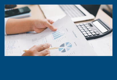 A person working with a calculator and data