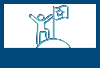 A person standing triumphantly at the top of a hill