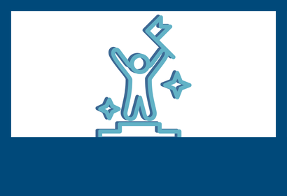 A person in the first place spot of a podium holding a flag