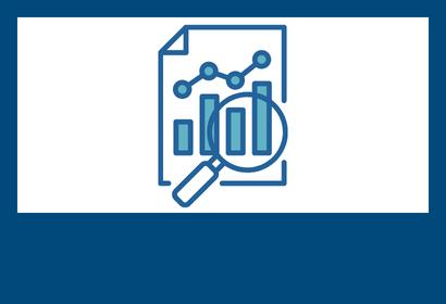 Paper with graphs underneath a magnifying glass