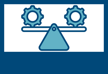 Two gears balancing on a scale