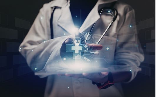 A person in a lab coat looking at a glowing device with digital medical symbols