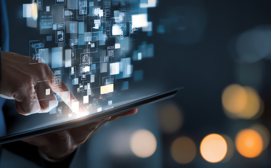 Image of a person pressing a button on a device and digital visualizations of data are coming out of it