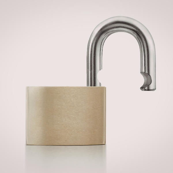 Open gold lock on a beige background