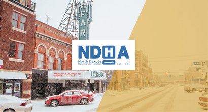 Image of NDHA logo overlaying skyline of Fargo, ND
